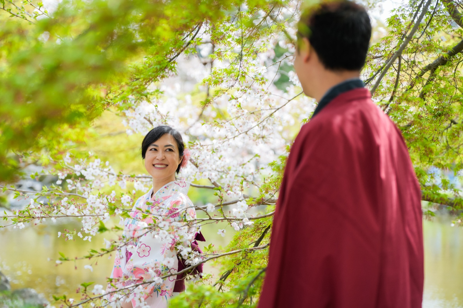 Jennifer in a kimono framed by cherry blossoms at Maruyama Park, Kyoto